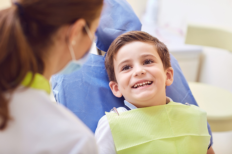 a child patient smiling before undergoing a dental checkup.